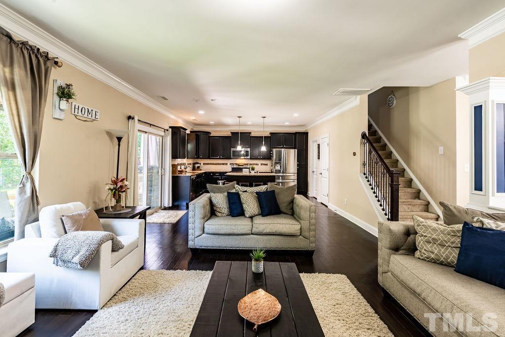 3578 Eastern Branch Road Raleigh, NC 27610 - Photo 2 of 24 a living room with furniture and wooden floor