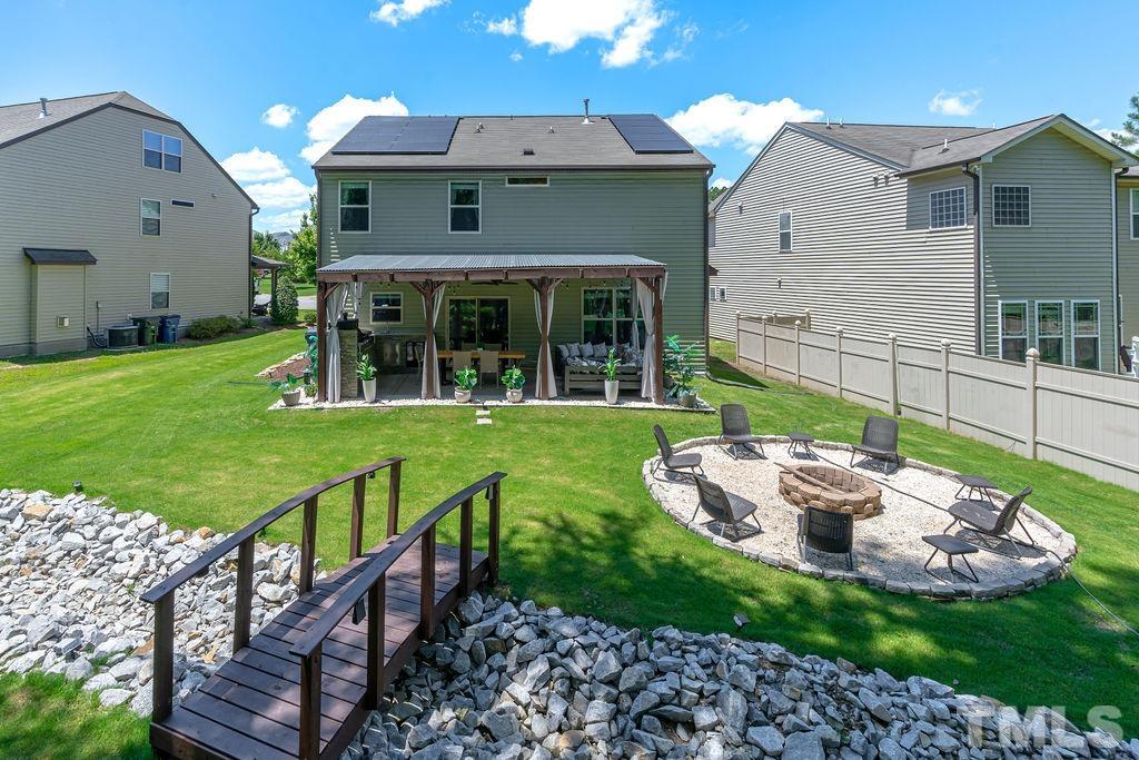 3578 Eastern Branch Road Raleigh, NC 27610 - Photo 24 of 24 a view of a house with backyard sitting area and garden