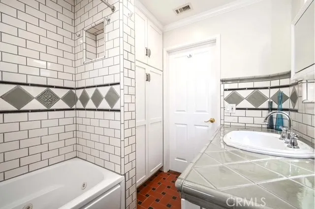a bathroom with a sink and a shower