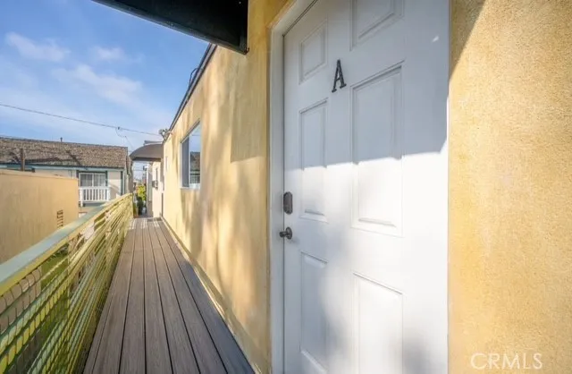 a view of a balcony with wooden floor