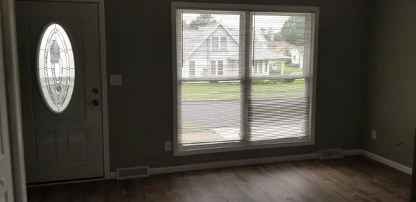 a view of floor window wooden floor and cabinet