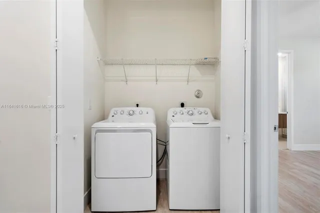 a utility room with dryer and washer