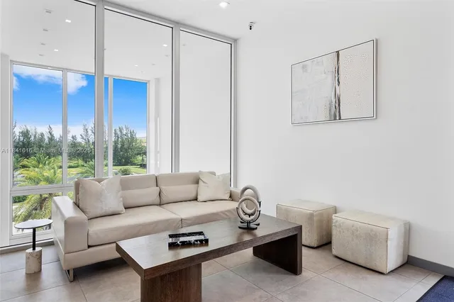 a view of a swimming pool with outdoor seating and city view