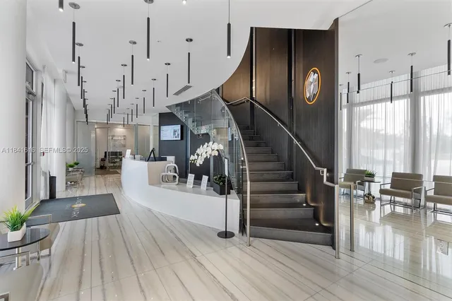 a view of a livingroom with furniture and window