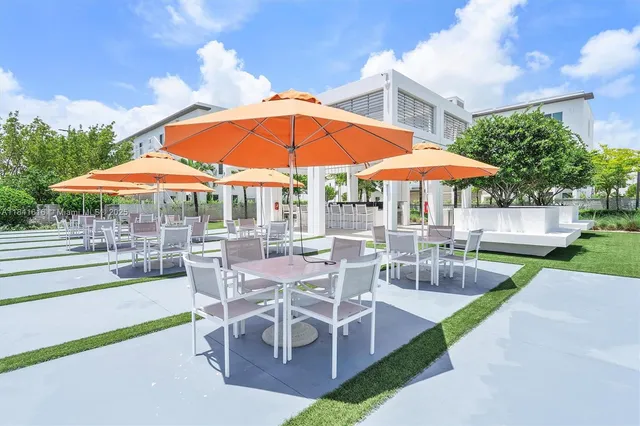 swimming pool view with a sitting space