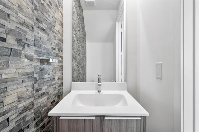 a sink with a mirror