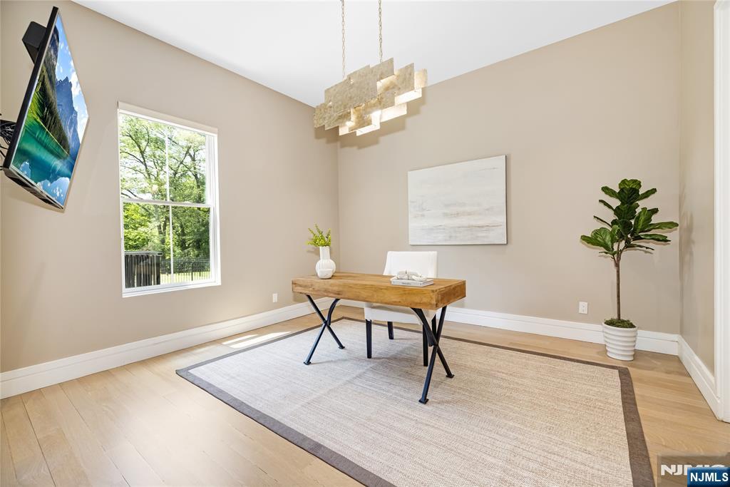 241 East Saddle River Road Saddle River, NJ 07458 - Photo 13 of 48 a living room with furniture a table and a potted plants