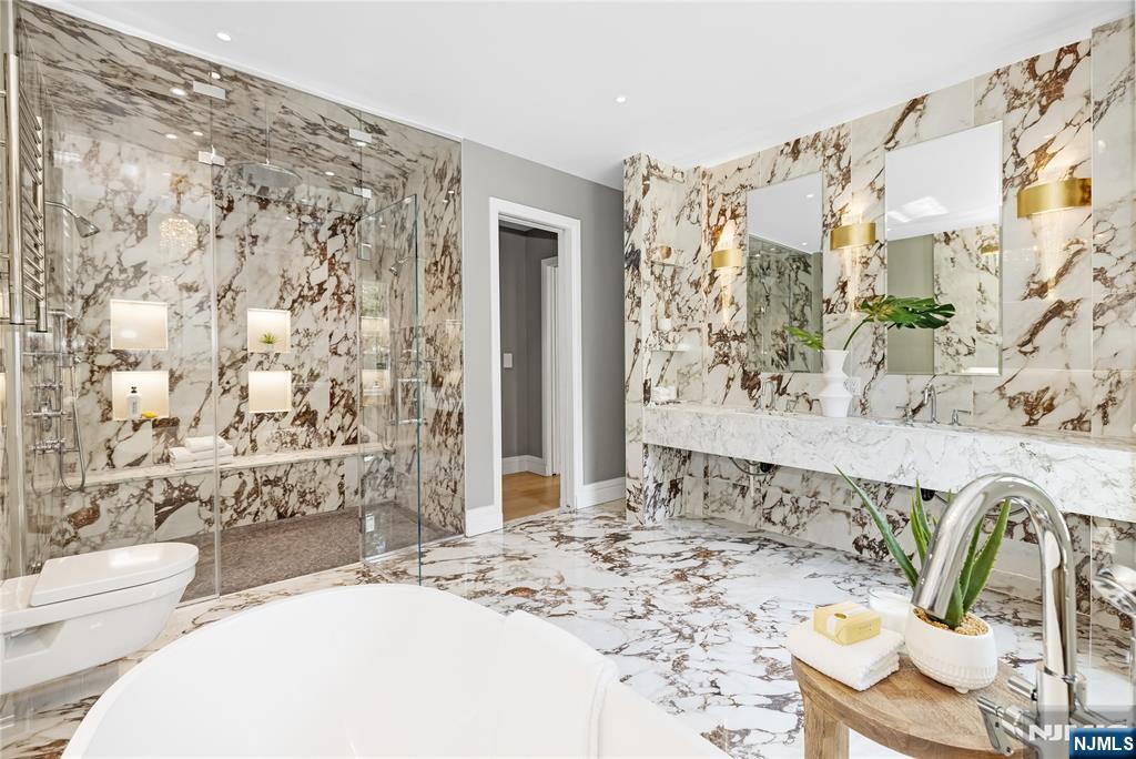 241 East Saddle River Road Saddle River, NJ 07458 - Photo 34 of 48 a bathroom with a sink toilet and shower