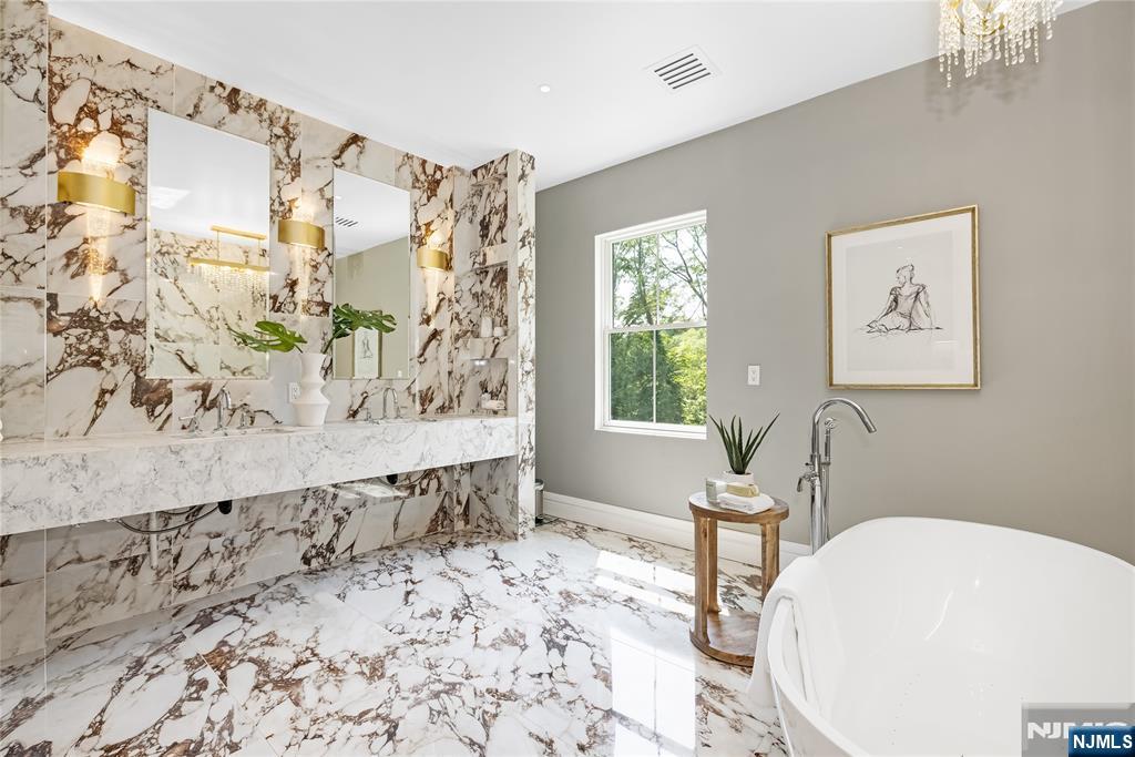 241 East Saddle River Road Saddle River, NJ 07458 - Photo 35 of 48 a bathroom with a bathtub and shower