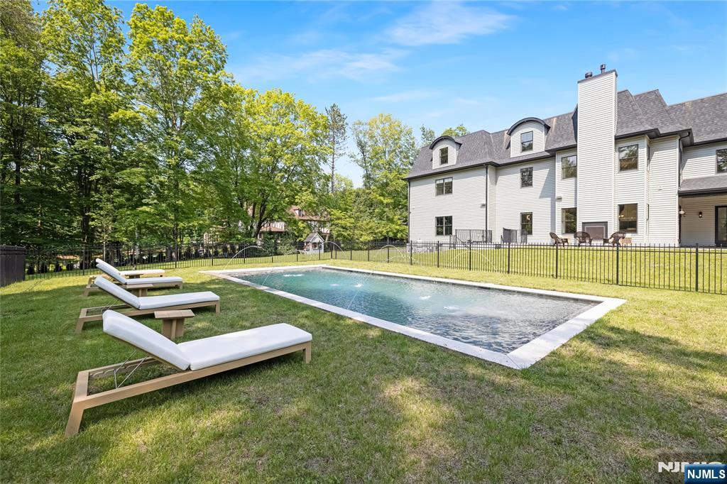 241 East Saddle River Road Saddle River, NJ 07458 - Photo 44 of 48 a view of a house with a backyard