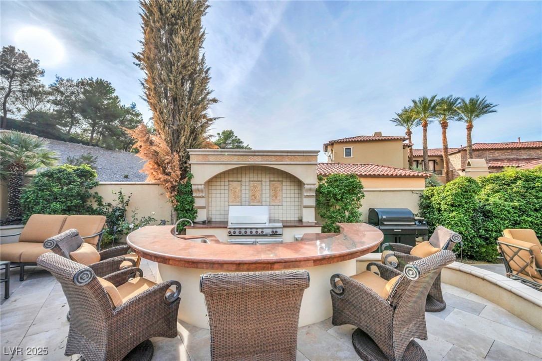 1793 Anelli Court Henderson, NV 89012 - Photo 16 of 47 View of patio / terrace featuring area for grilling and a sink