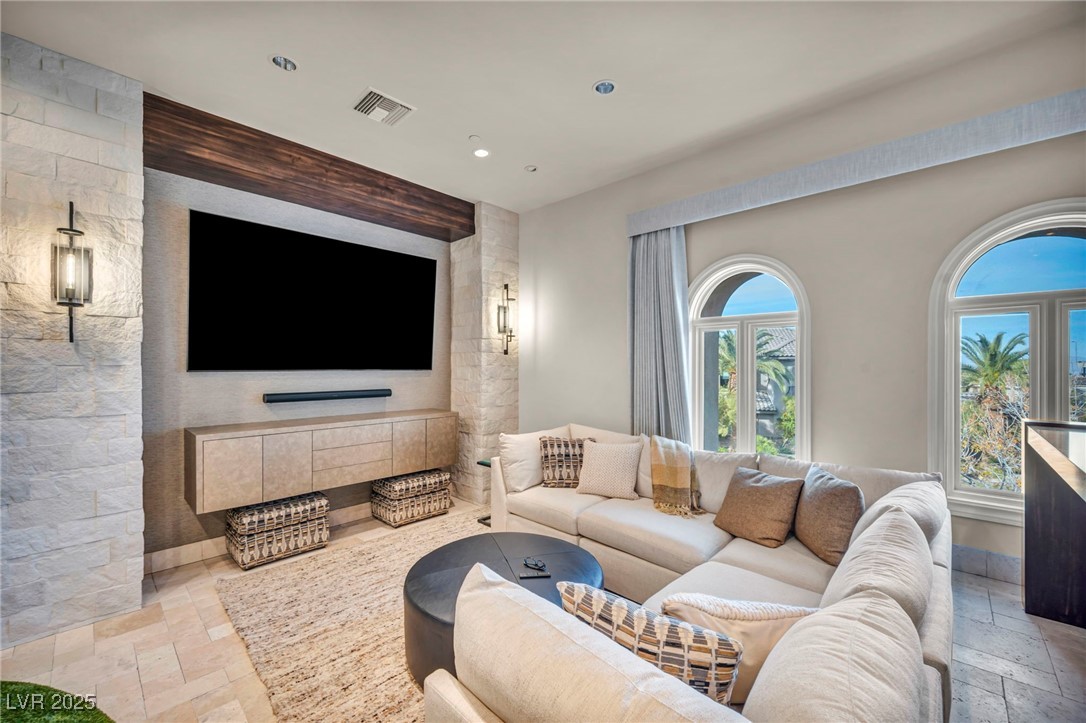 1793 Anelli Court Henderson, NV 89012 - Photo 25 of 47 Living room with stone tile flooring and recessed lighting