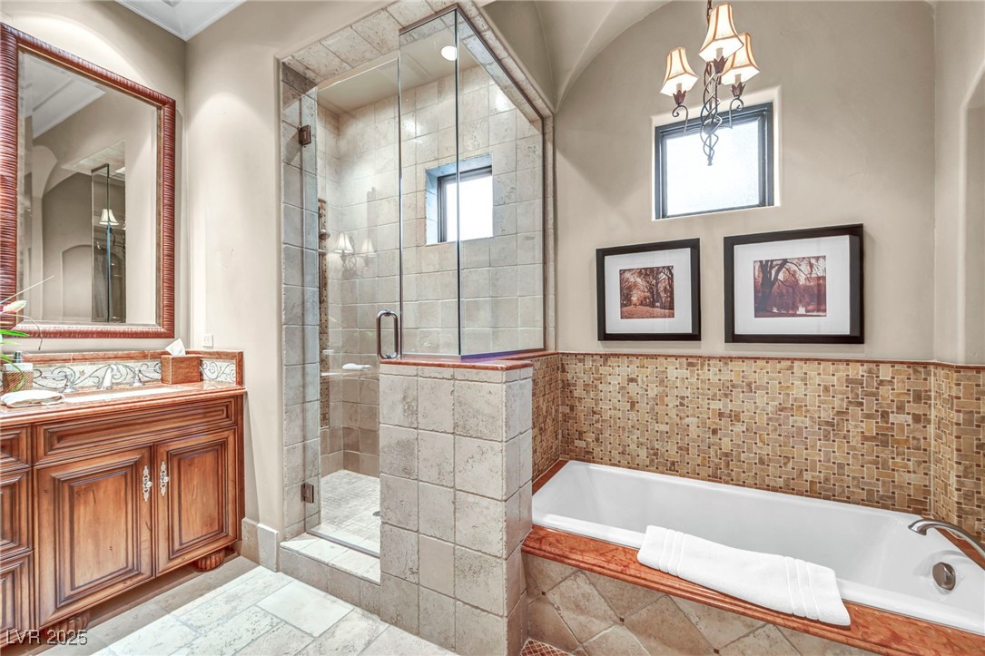 1793 Anelli Court Henderson, NV 89012 - Photo 43 of 47 Full bathroom featuring a bath, a shower stall, and vanity