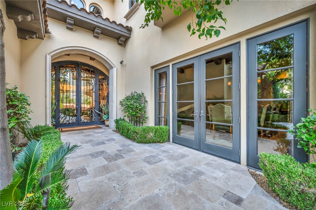 1793 Anelli Court Henderson, NV 89012 - Photo 8 of 47 Doorway to property featuring french doors and stucco siding