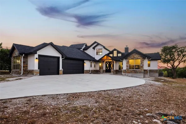 front view of a house next to a yard