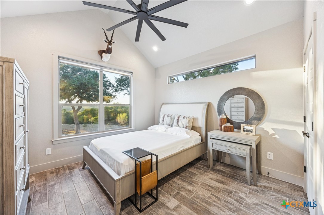 134 Flanders Fischer, TX 78623 - Photo 28 of 37 a bedroom with a bed and a window