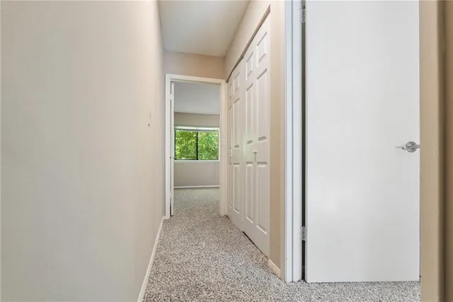 a view of a hallway with a white walls