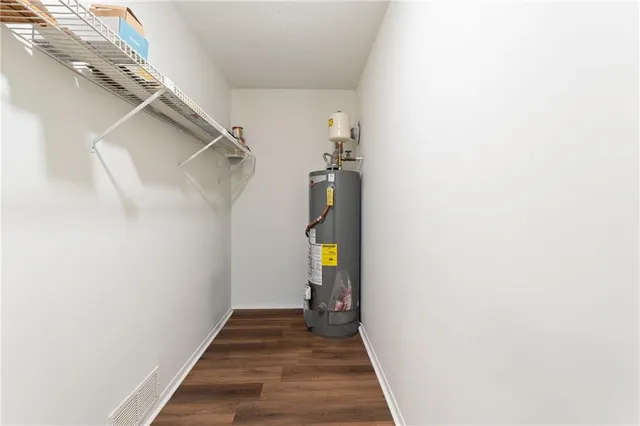 a view of hallway with wooden floor