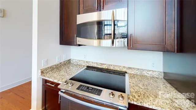 a kitchen with a stove and a microwave