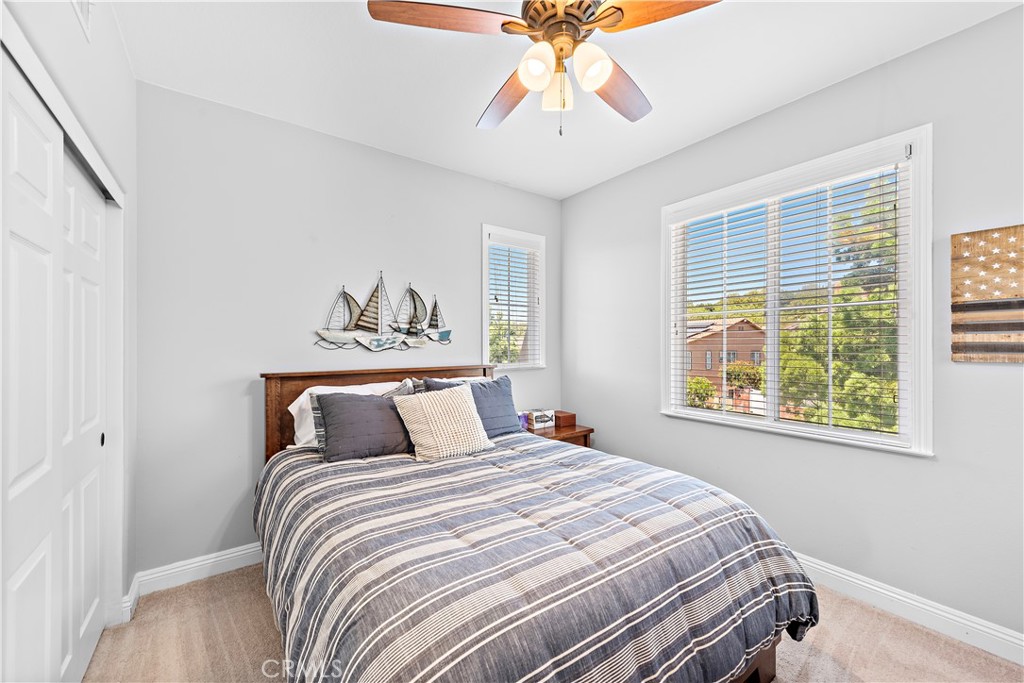 10 Blue Spruce Drive Ladera Ranch, CA 92694 - Photo 31 of 45 a bedroom with a bed and a chandelier