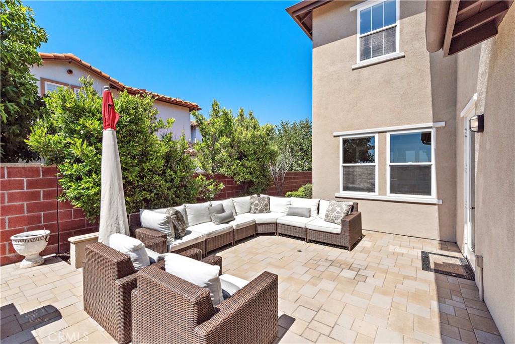 10 Blue Spruce Drive Ladera Ranch, CA 92694 - Photo 35 of 45 a view of a patio with couches table and chairs and potted plants