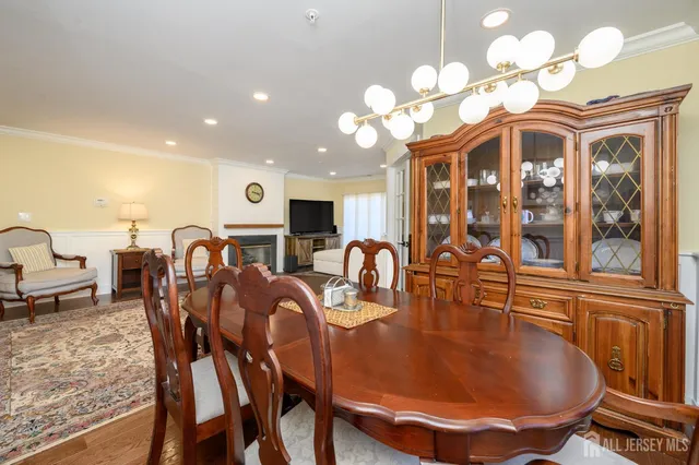 a large kitchen with a table and chairs