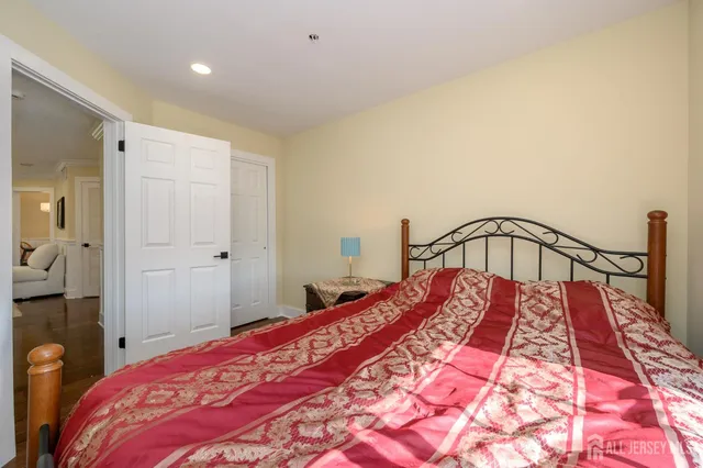 a bedroom with a bed and a mirror