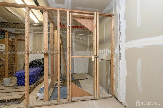 a car parked in front of a white house