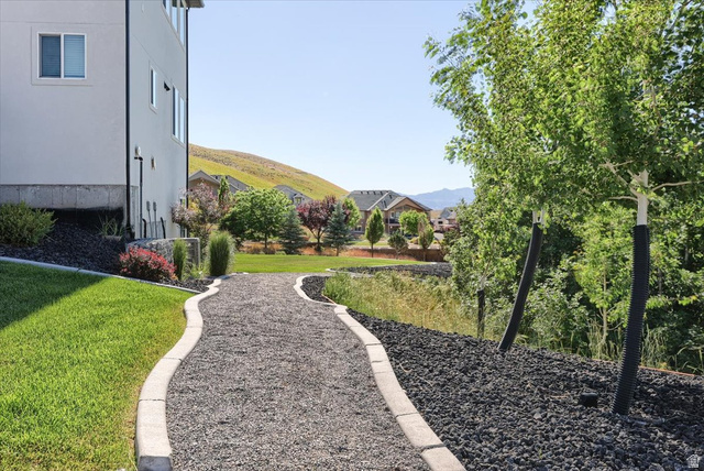 828 South Deer Road Tooele, UT 84074 - Photo 37 of 51 Curved gravel pathway bordered by concrete curbing