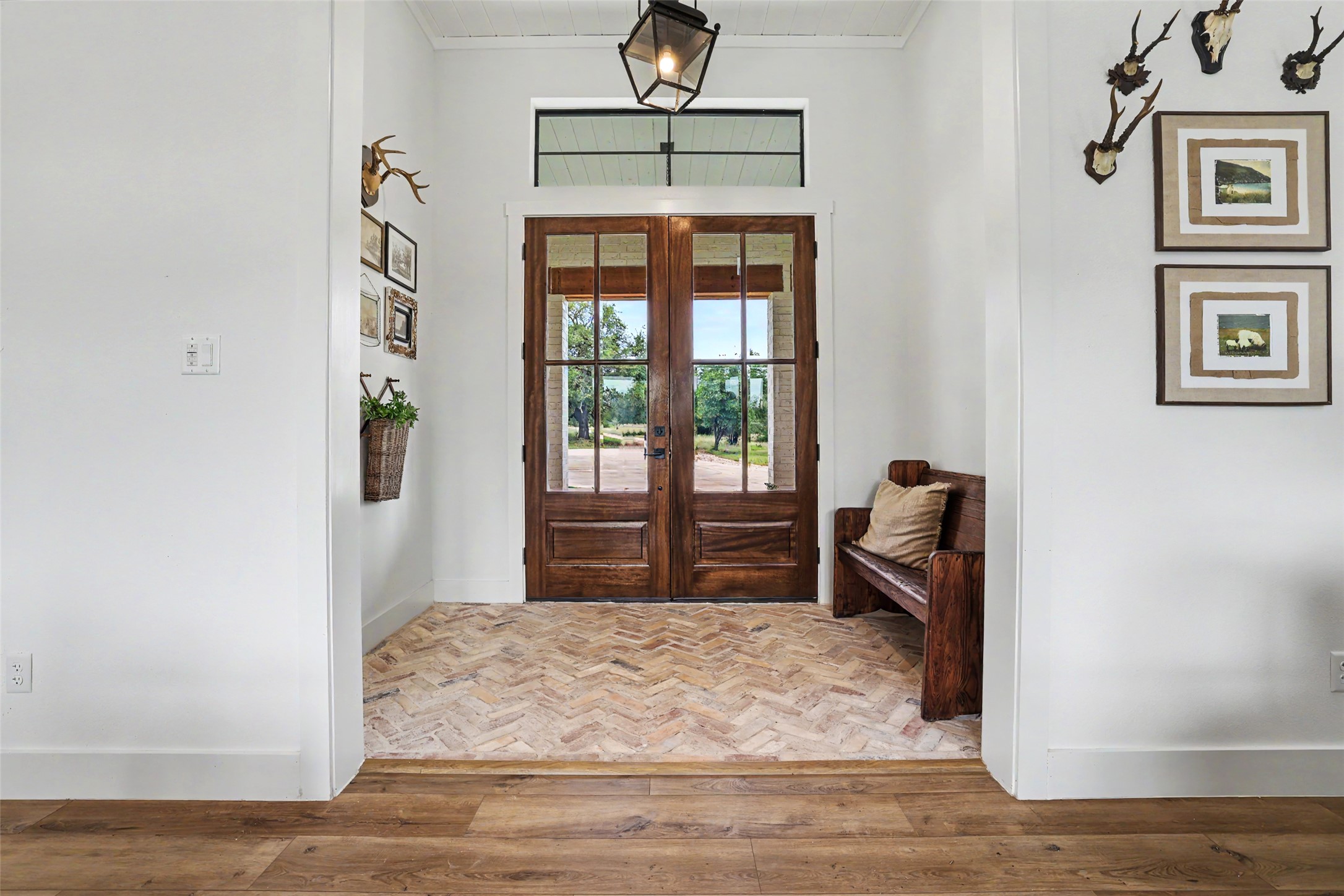7670 Shiny Top Ranch Lane Salado, TX 76571 - Photo 5 of 40 a bedroom with a bed and a chandelier