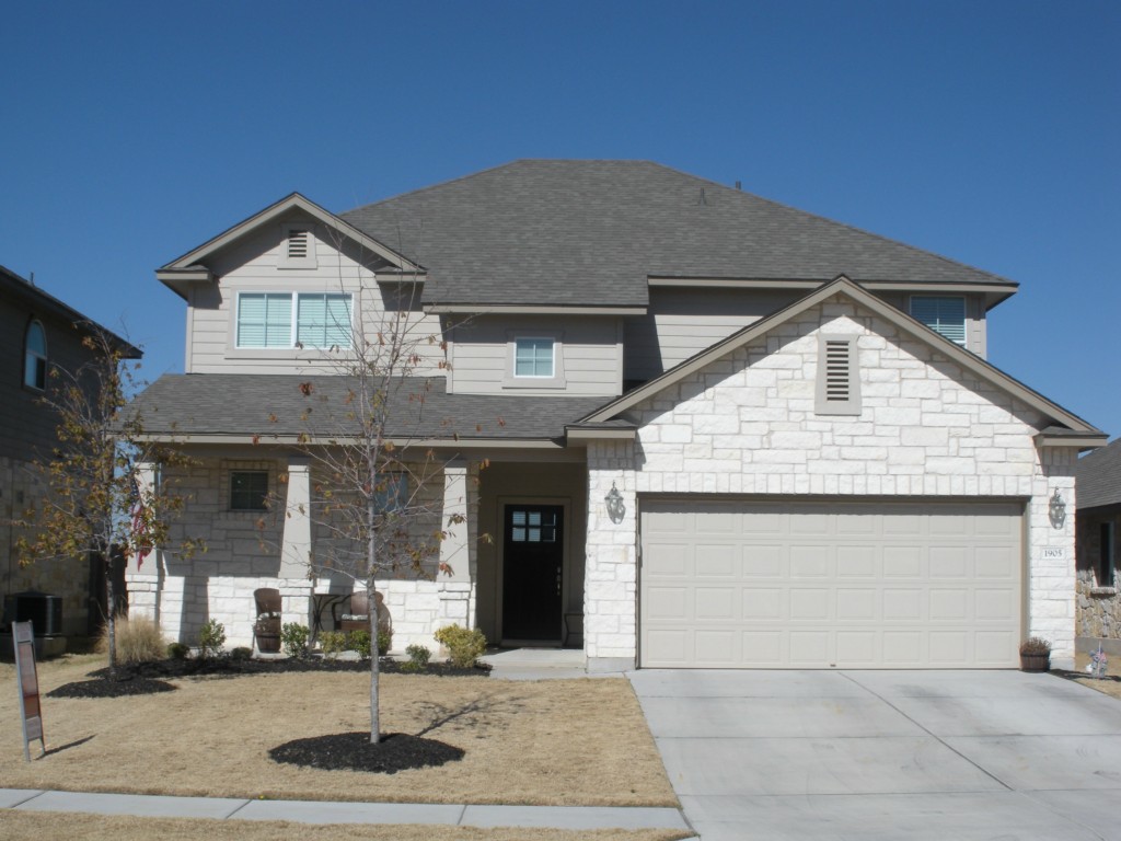 1905 Laminar Creek Road Cedar Park, TX 78613 - Photo 1 of 1 a front view of a house with garage and