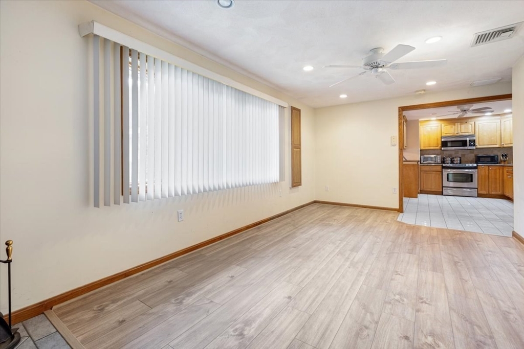 6 Sycamore Street Danvers, MA 01923 - Photo 14 of 30 wooden floor in an empty room with a window
