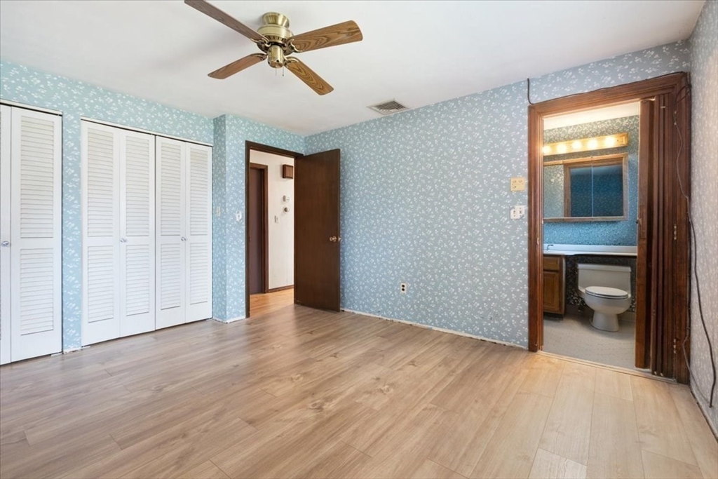 6 Sycamore Street Danvers, MA 01923 - Photo 18 of 30 a view of empty room with wooden floor and fan