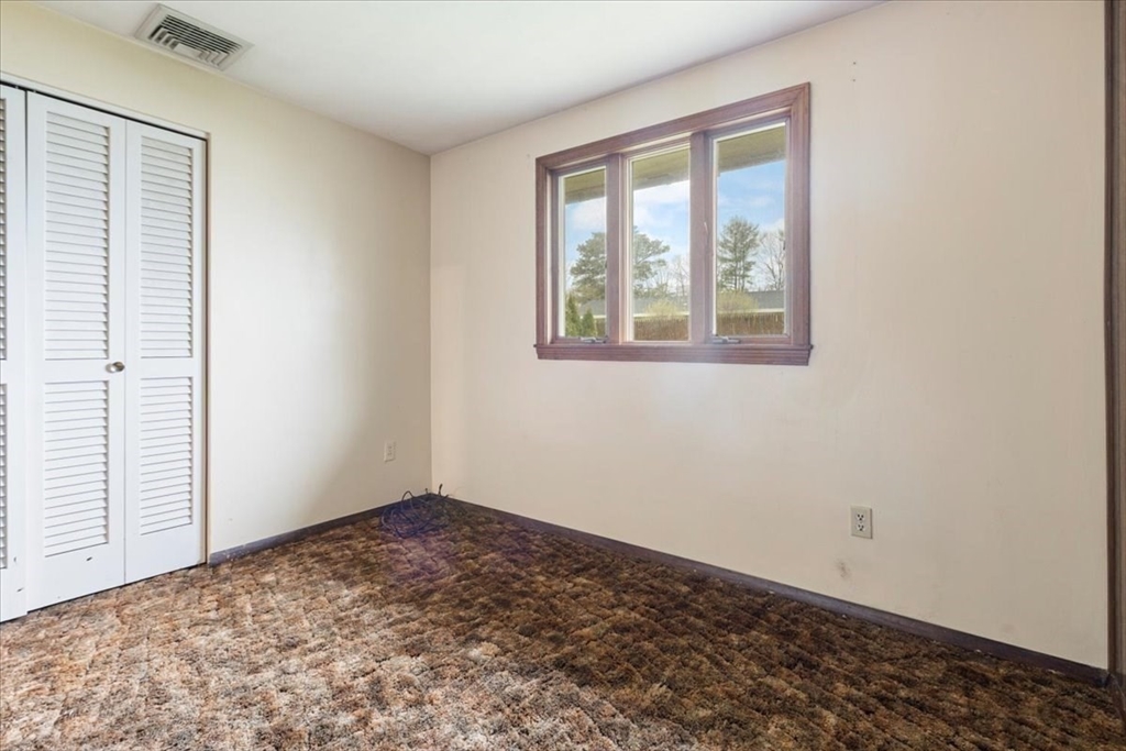6 Sycamore Street Danvers, MA 01923 - Photo 24 of 30 an empty room with a window