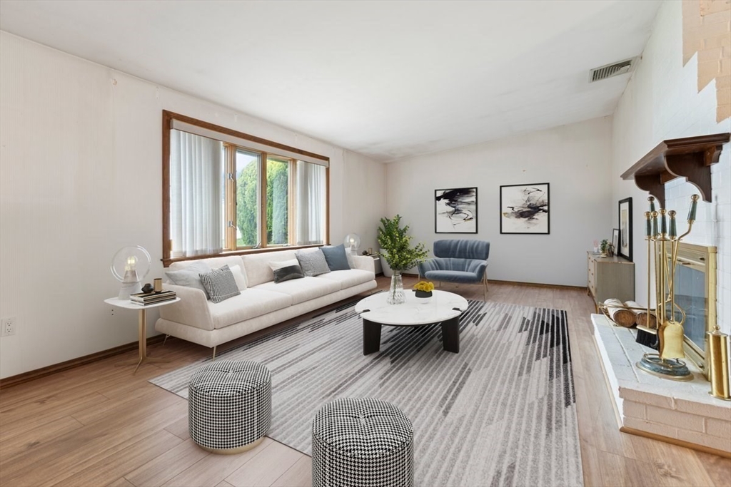 6 Sycamore Street Danvers, MA 01923 - Photo 3 of 30 a living room with furniture and a flat screen tv