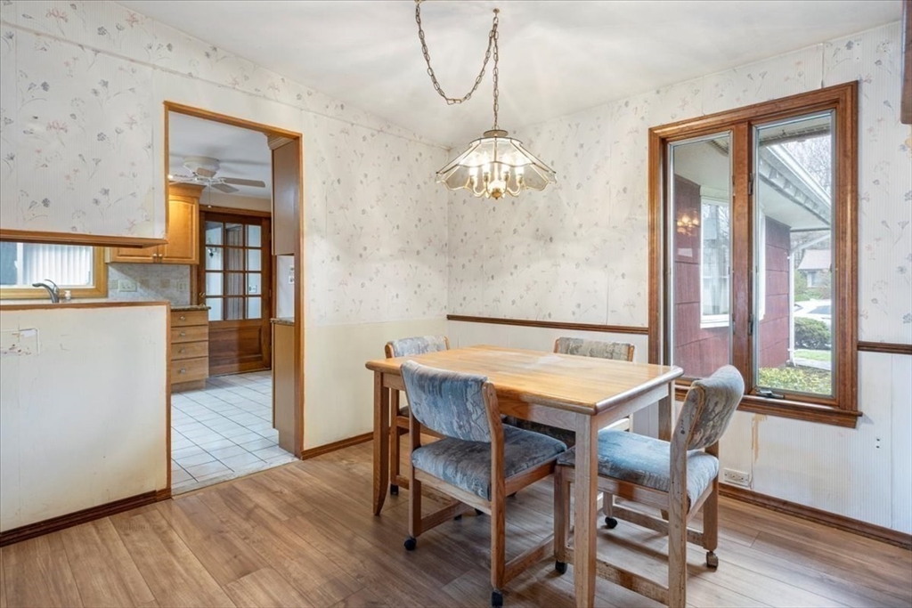 6 Sycamore Street Danvers, MA 01923 - Photo 7 of 30 a view of a dining room with furniture wooden floor and chandelier
