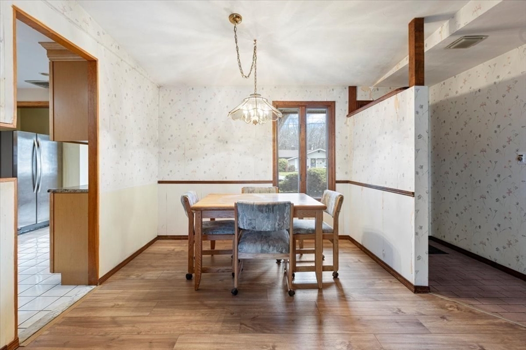 6 Sycamore Street Danvers, MA 01923 - Photo 8 of 30 a view of a dining room with furniture window and wooden floor