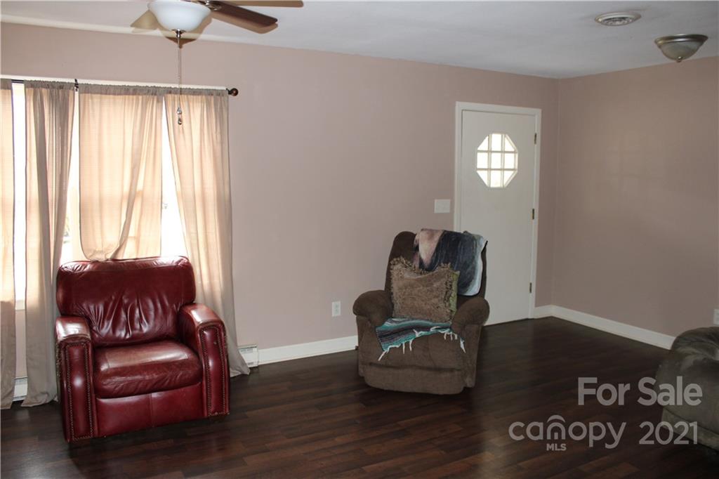 1021 Faith Road Salisbury, NC 28146 - Photo 2 of 12 a living room with furniture and a window