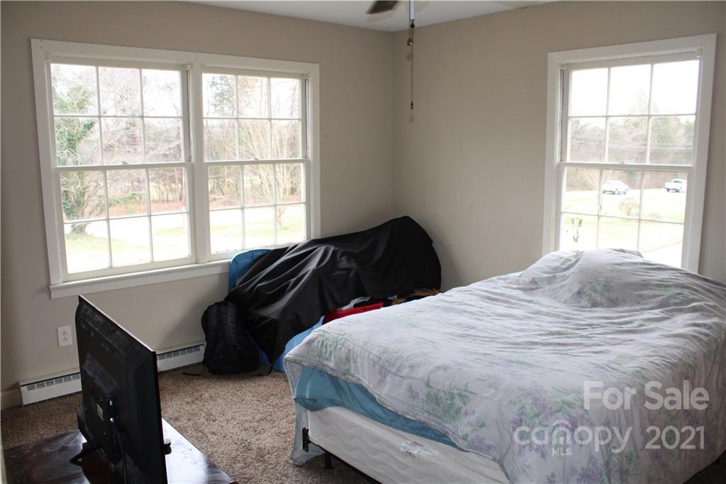 1021 Faith Road Salisbury, NC 28146 - Photo 7 of 12 a bedroom with a bed and a window