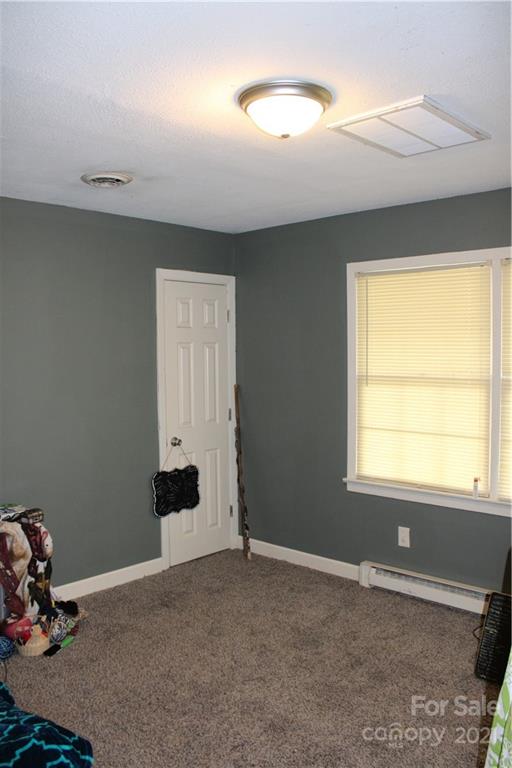 1021 Faith Road Salisbury, NC 28146 - Photo 10 of 12 a view of a room with gym equipment and a window