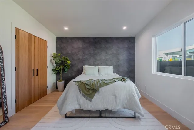 a bathroom with a double vanity sink mirror and bathtub