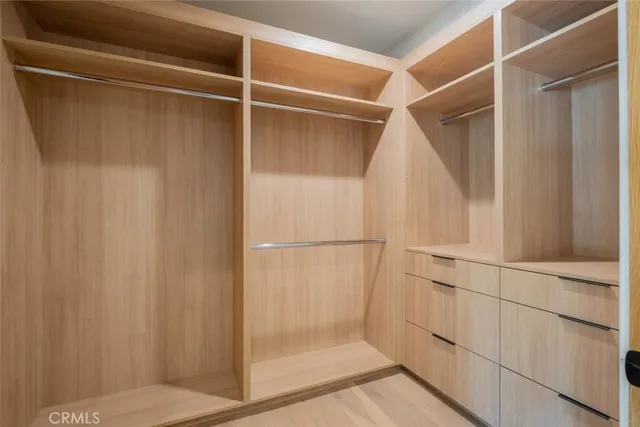 a bathroom with a granite countertop sink a mirror and vanity