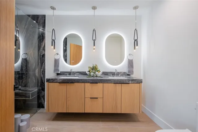 a bathroom with a sink and mirror
