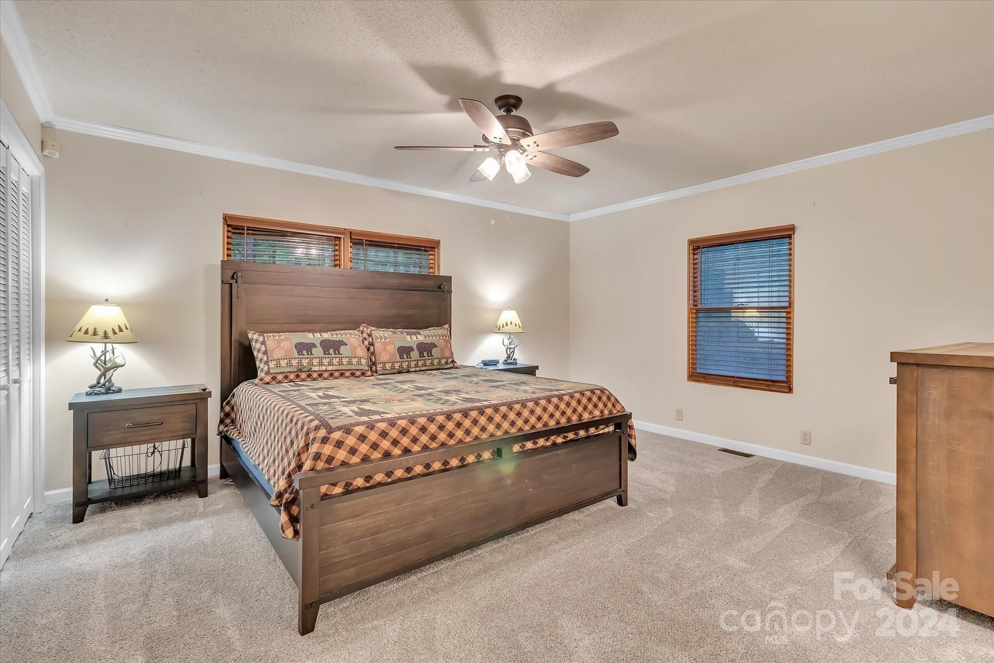 824 Rutledge Drive Catawba, SC 29704 - Photo 15 of 25 a bedroom with a large bed and a chandelier