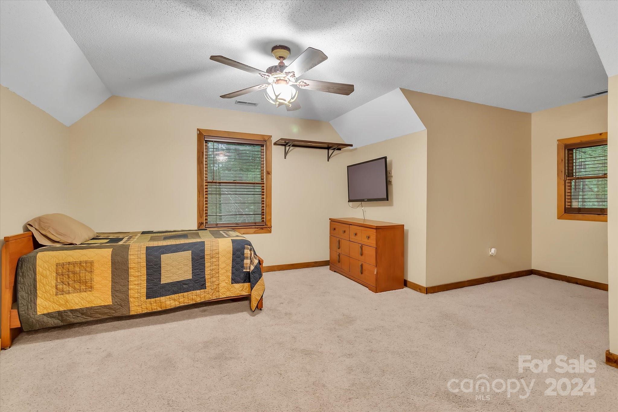 824 Rutledge Drive Catawba, SC 29704 - Photo 20 of 25 a living room with a couch and a chandelier