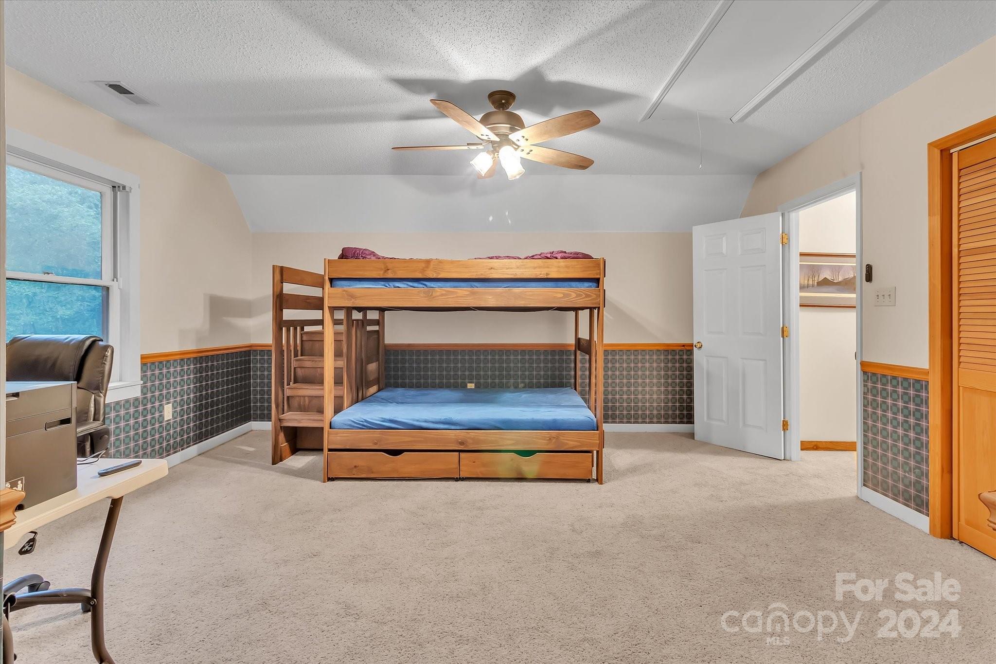 824 Rutledge Drive Catawba, SC 29704 - Photo 22 of 25 a bedroom with furniture and a chandelier