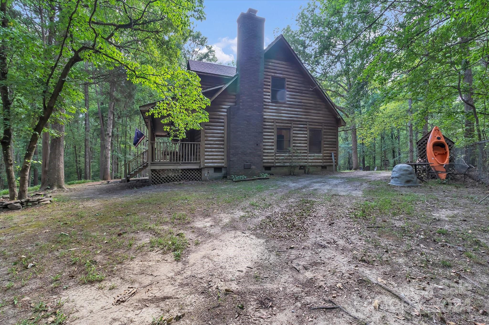 824 Rutledge Drive Catawba, SC 29704 - Photo 4 of 25 a view of a backyard with large trees