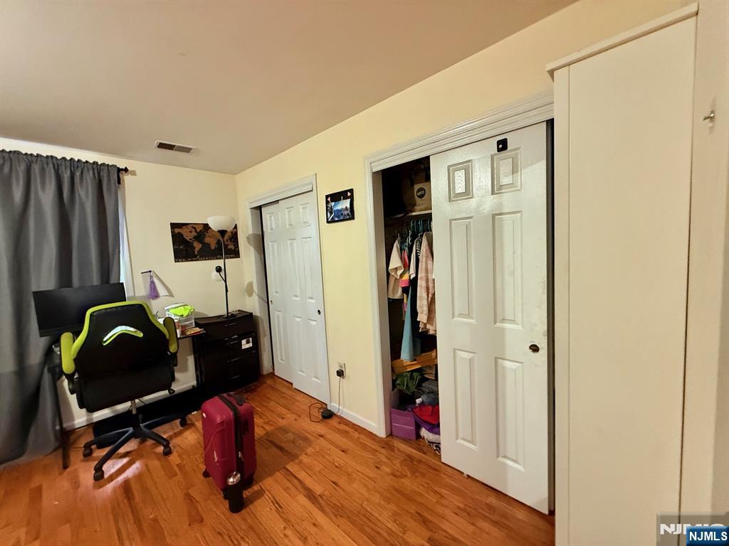 252 Passaic Avenue, Unit 2F East Newark, NJ 07029 - Photo 9 of 11 a view of a workspace with furniture and gym equipment