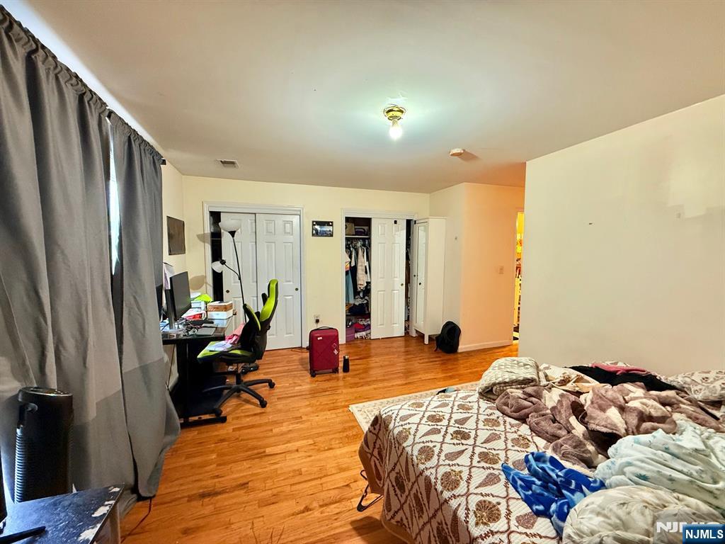 252 Passaic Avenue, Unit 2F East Newark, NJ 07029 - Photo 10 of 11 a bed room with a bed and a window