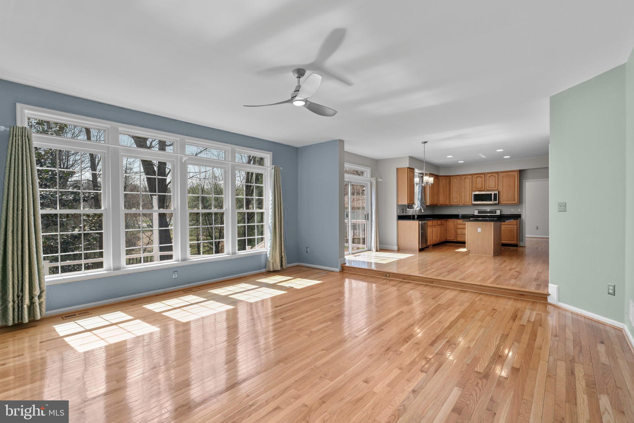 4520 Tulip Way Ellicott City, MD 21043 - Photo 11 of 63 a view of an empty room with wooden floor and a window